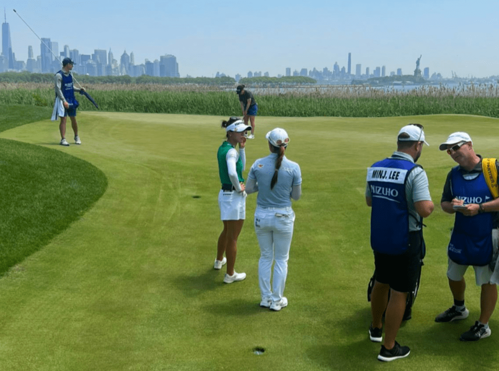 Professional golf caddie, Henry Fall alongside wife Dana Fall at Liberty National in New York with playing partners, Lydia Ko and Minjee Lee.