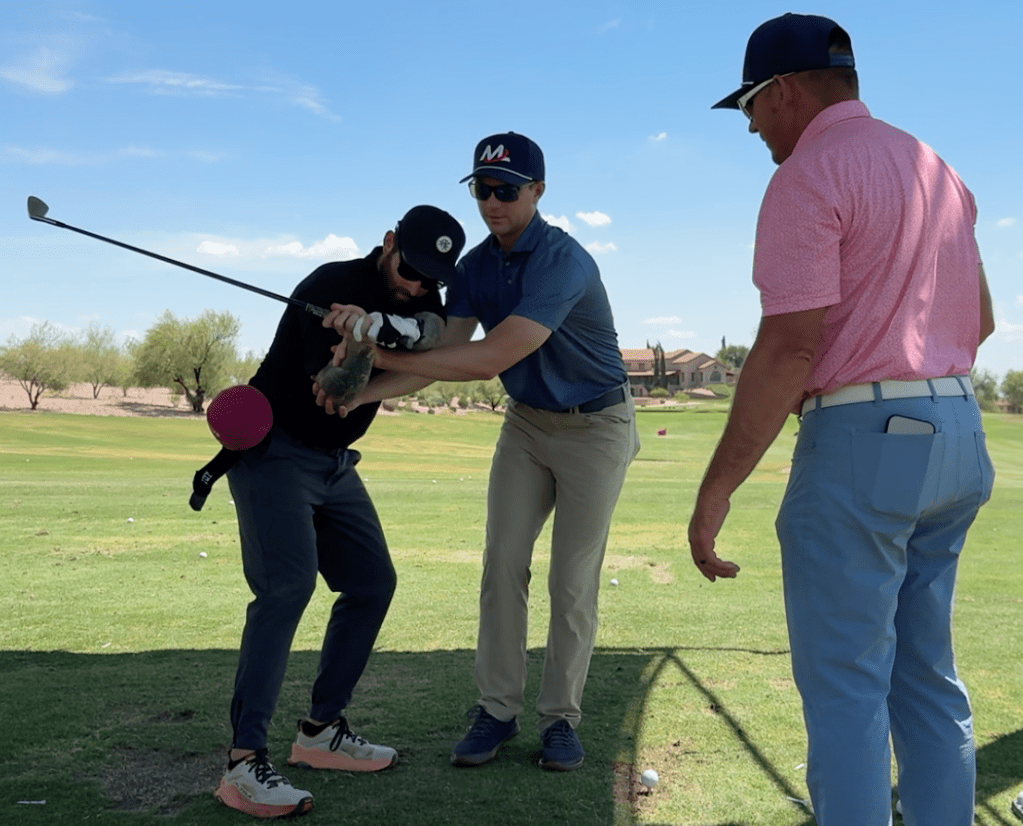 Henry Fall and Milo Lines gives a golf lesson to a student at Superstition Mountain Golf and Country Club in Gold Canyon, Arizona.