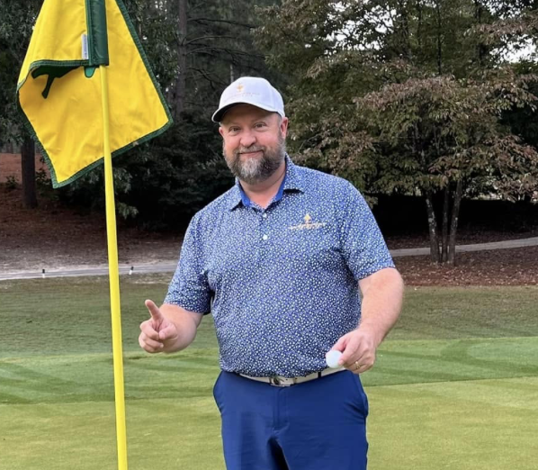 Henry Fall receives a testimonial from a student following a recent golf lesson.